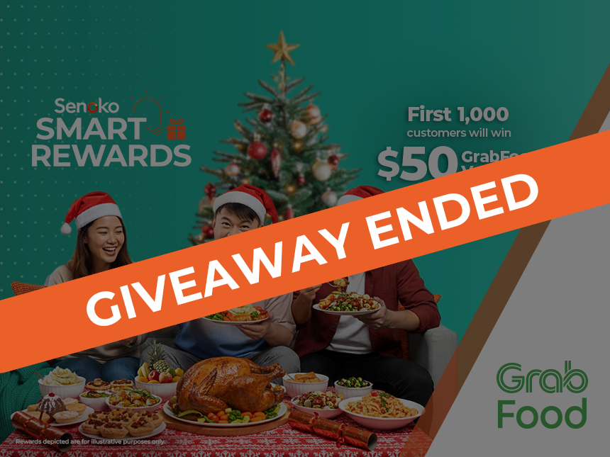 Three friends wearing Santa hats enjoying a festive meal together at home after winning Senoko Energy Smart Rewards quiz where they received $50 GrabFood vouchers.